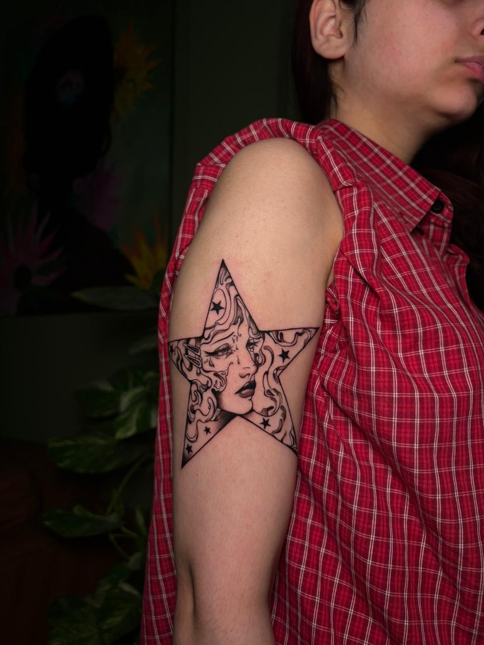 Illustrative blackwork tattoo